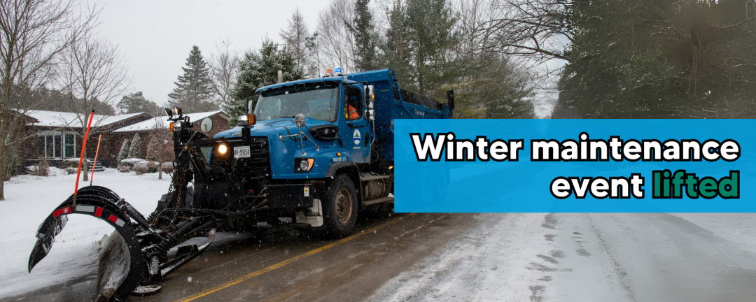 snow plow plowing snow with the words winter maintenance event lifted